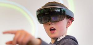 A boy wearing a pair of virtual reality glasses